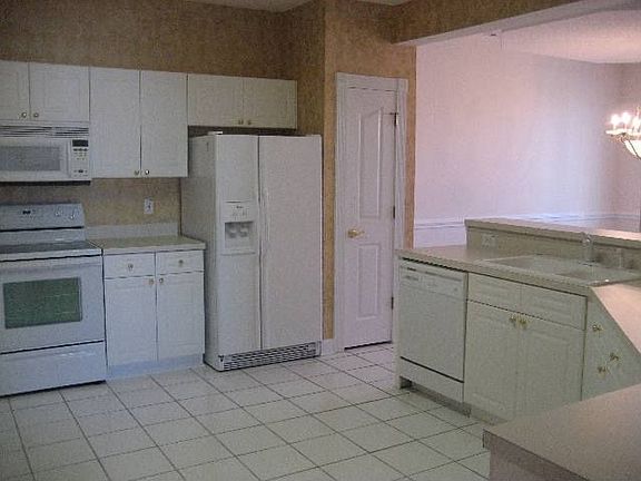 Spacious kitchen with tile floors and lots of counter space!