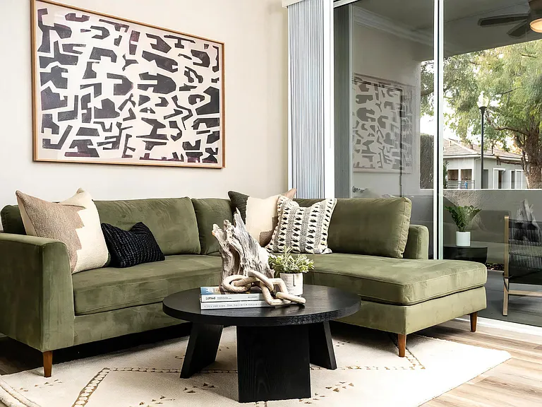 Light-Filled Living Room with Stylish Decor and Private Patio View