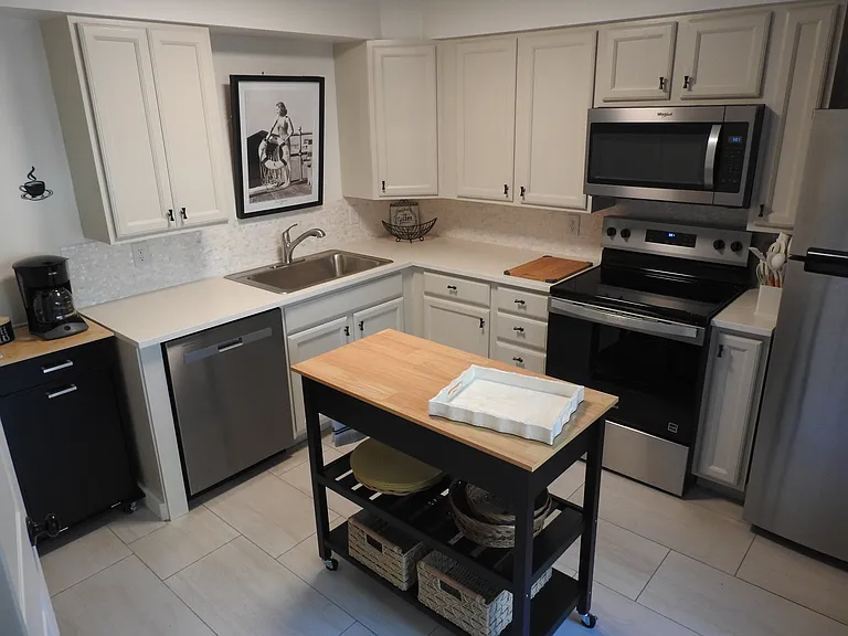 Totally renovated kitchen. All new appliances, quartz countertop, porcelain flooring