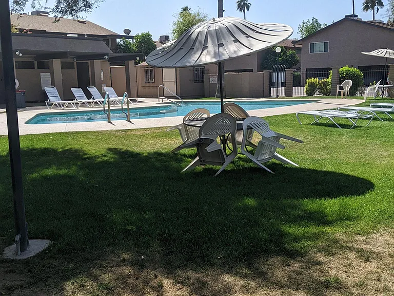 Large grassy area by community pool.