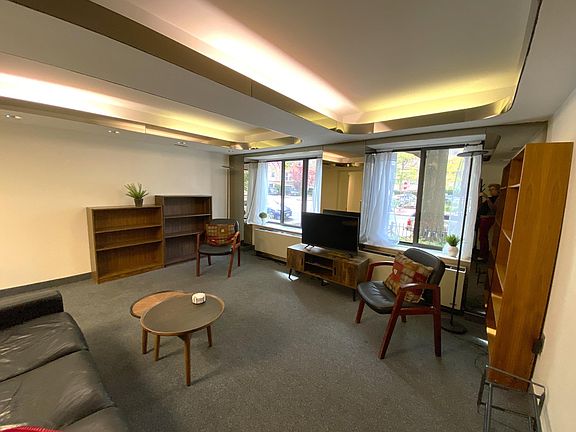 Living room with TV and view towards I (Eye) Street