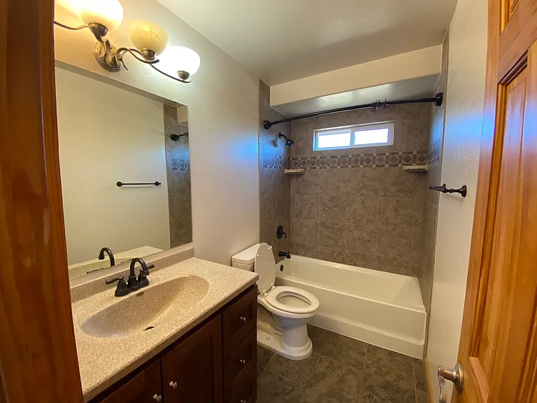 Clean and functional bathroom with convenient access for family or guests.