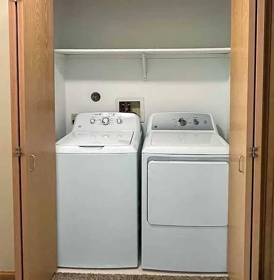 Skip the laundromat - your full-size washer and dryer are tucked neatly away in a hallway closet for ultimate everyday convenience.