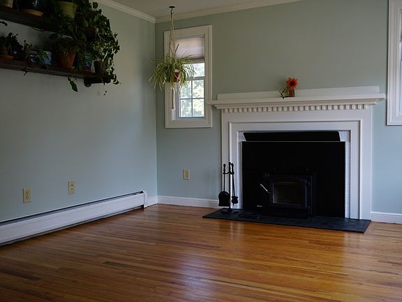 Living room with fireplace insert and tiled slate hearth