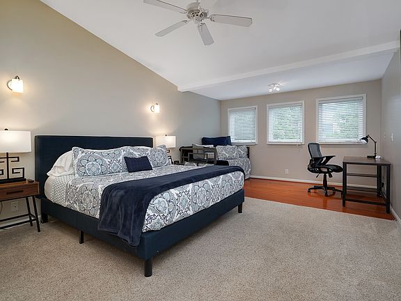 3rd floor bedroom with work area and private bathroom.