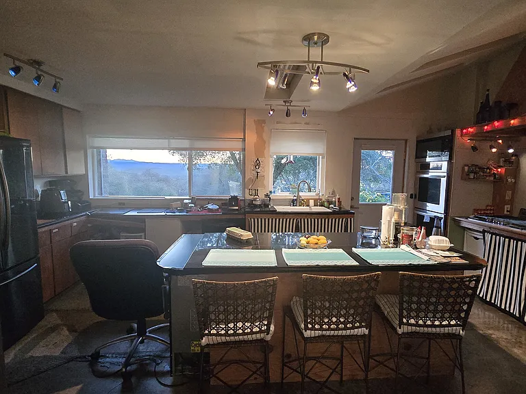 Room for 3 to sit at the center island. Island is wide enough for someone to prep food and others to sit to eat at the same time. Windows face the eastern Sierra view.