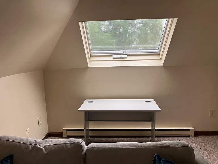 Office/computer area with large. Chair coming.