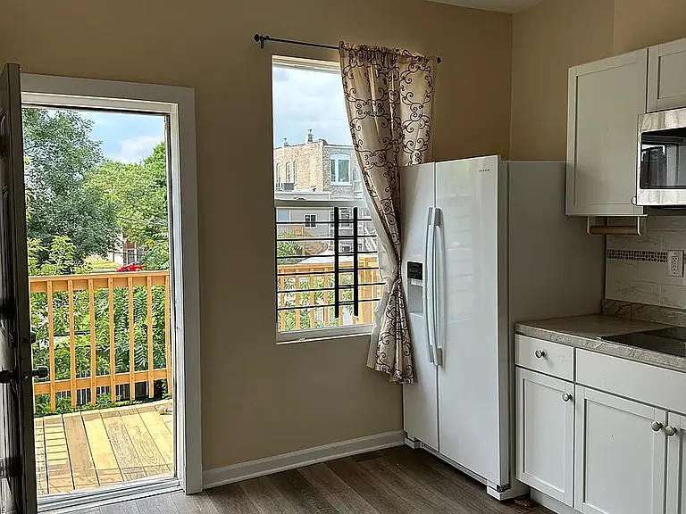 Kitchen with private back porch.