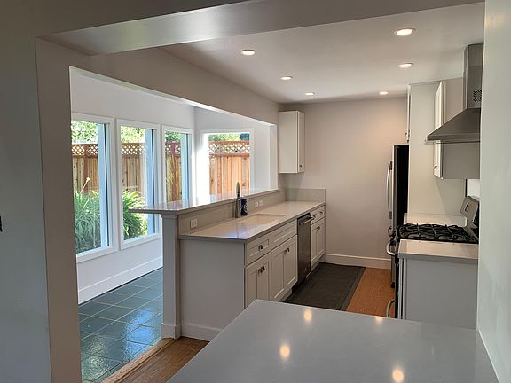 Newly remodeled kitchen with breakfast bar and morning light