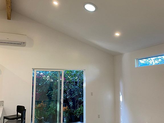 Kitchen + living room lead to private and fenced patio/garden!