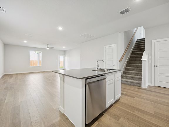 Kitchen in the Haylee home plan by Trophy Signature Homes - REPRESENTATIVE PHOTO
