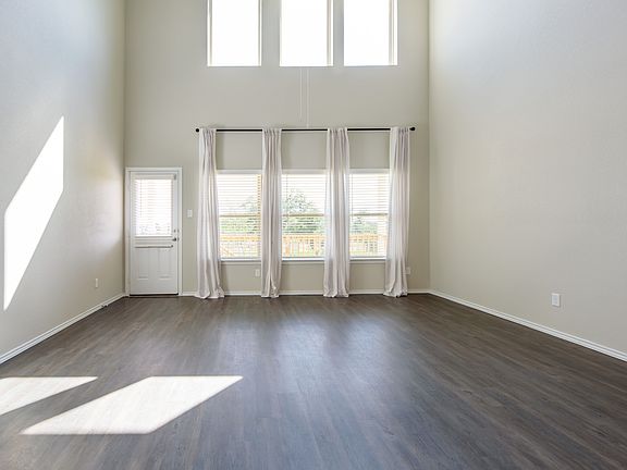 Open living area with picture windows.