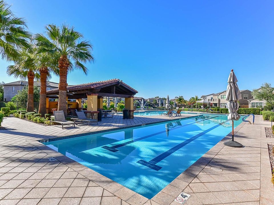Heated lap pool and jacuzzi. Covered ramada with fireplace and seating for parties, as well as 2 bathrooms.