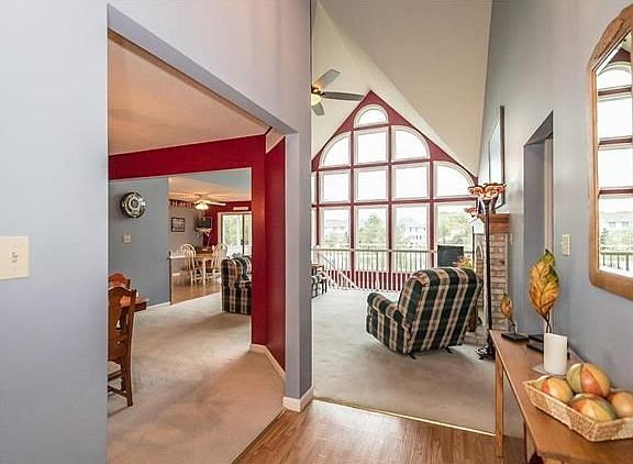 As soon as you enter the home you will see the beautiful atrium windows with a view of the lake! To the left is the Dinning Room and the hallway to the right leads back to the 3 bedrooms and 2 full bathrooms.