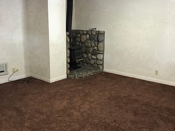  Living room and wood burner. 