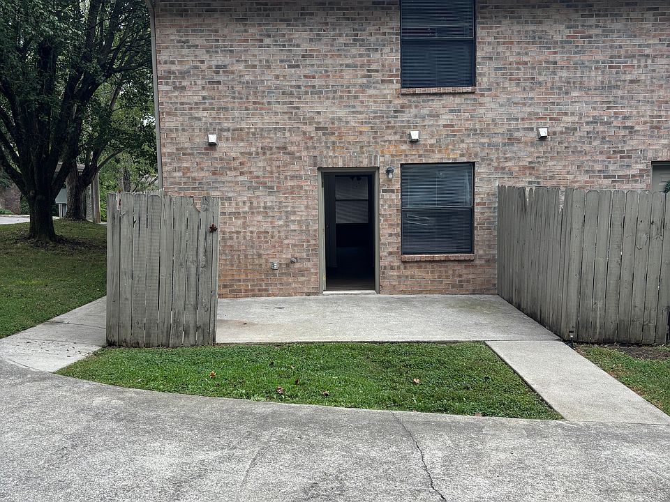 Back Patio leading to kitchen. Parking is where the photo is taken from.