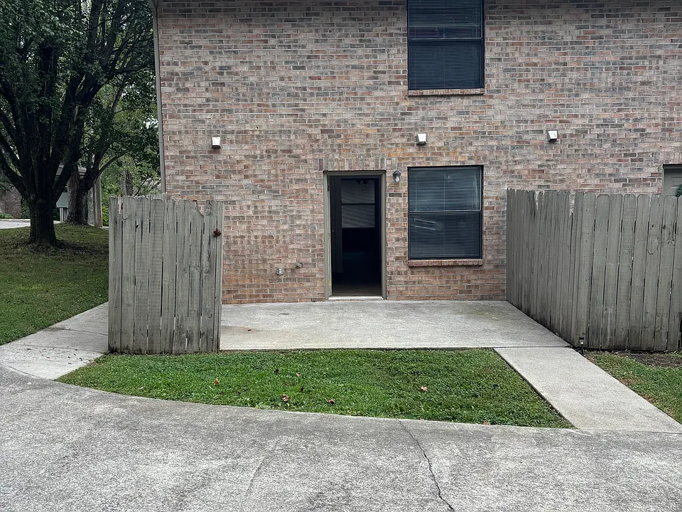 Back Patio leading to kitchen. Parking is where the photo is taken from.