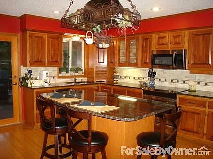 Main Level Kitchen
						:
						Granite island/countertops, stainless steel appliances, maple cabinets.