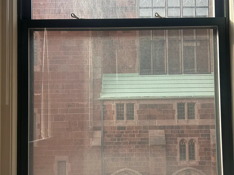 Private views of historic church from living room windows.