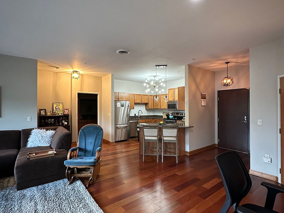 Open floor plan (kitchen, living room, desk w/ coffee bar)