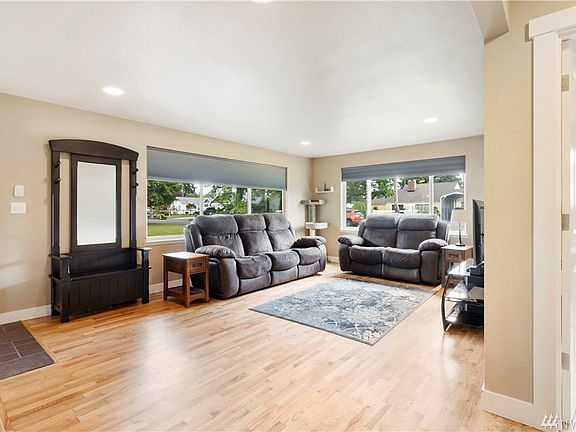 Enter the home into a nice, large living room. Huge windows offer plenty of natural light. 