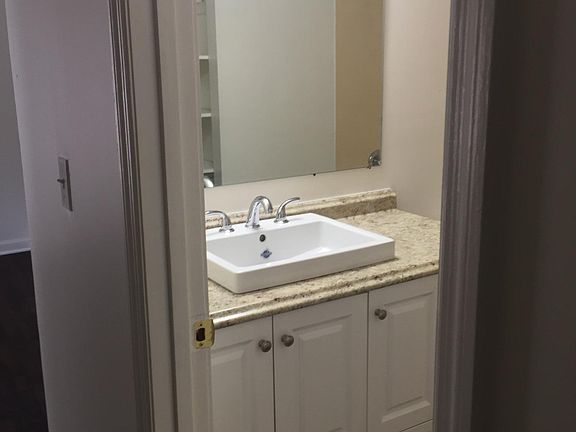 Bathroom; fresh paint, new vanity and new lighting.