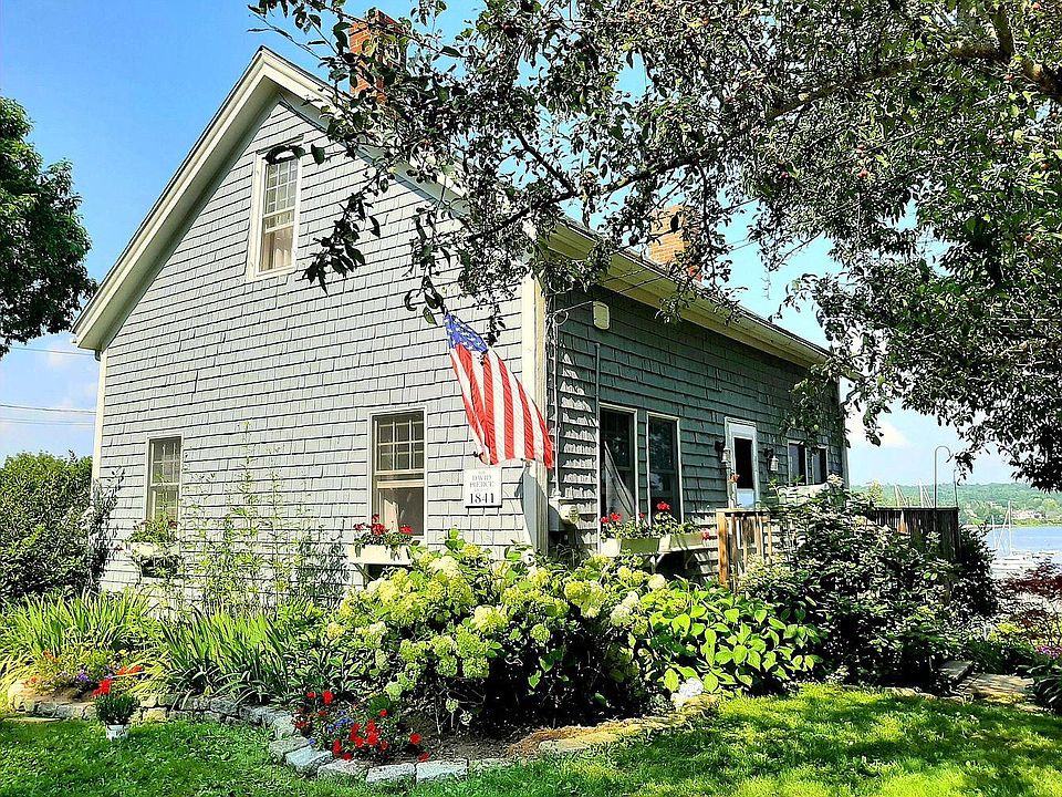Front of house with mature gardens (tenant not responsible for yardwork).