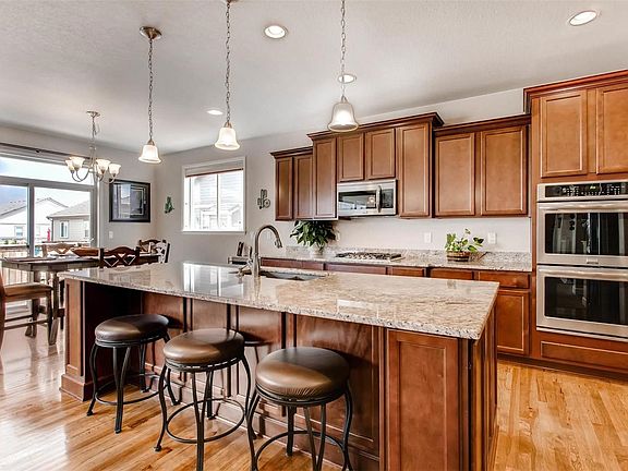 Large granite island with additional storage and outlets, Gourmet kitchen with double convection oven, 5 burner gas range
