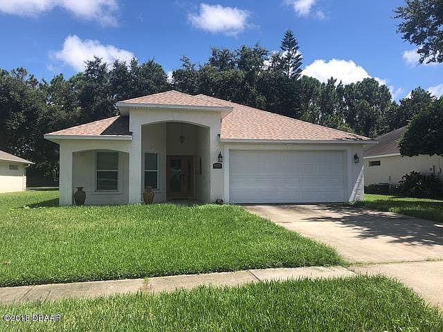 Front yard of property. It has a north facing 2-car garage with a covered front porch. Yard work included in the rent. You have Great neighbors and neighborhood to call home. Walking distance to Port Orange Middle School.