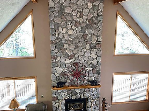 Stone gas log fireplace