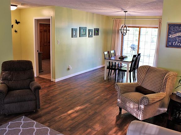 Fresh and Inviting Living Room Open to the Kitchen