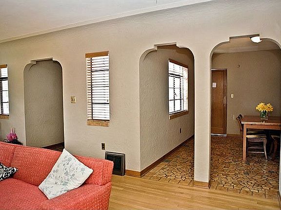 Archways, coved ceilings, oak and tile floors