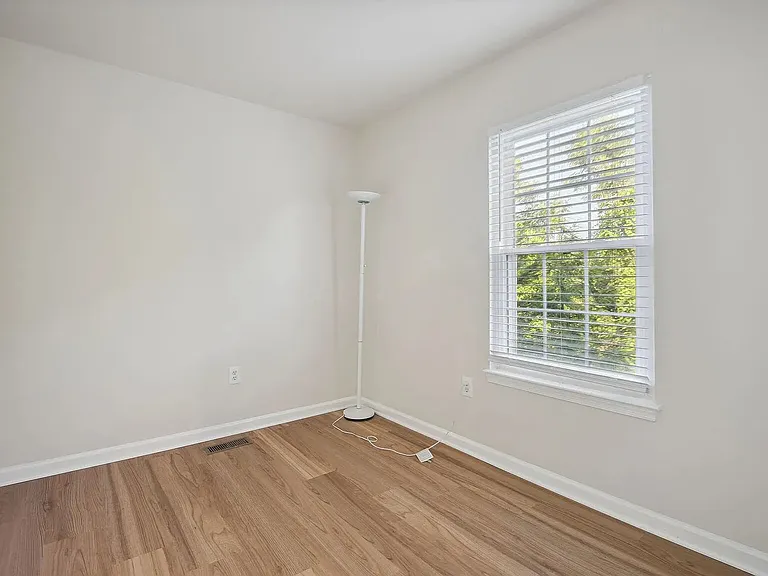 Overview of the third bedroom on the upper level (closet not shown).