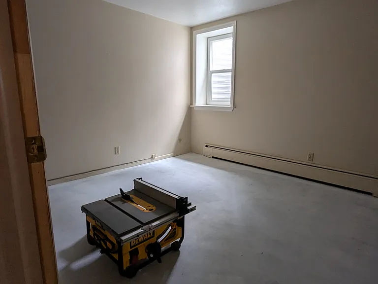Downstairs bedroom or storage. Egress window with great morning sunshine.