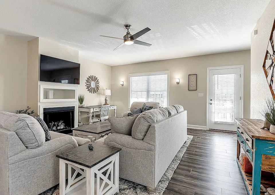 Living room area is open with plenty of seating along with desk working area for those who work remotely! Patio door next to living room to enjoy as well.