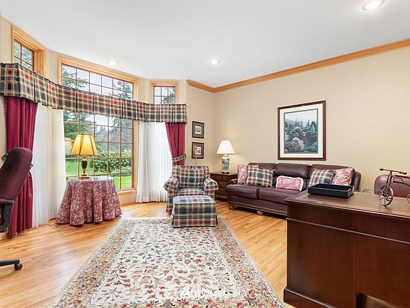 Executive sized office or den with peaceful picture window, looking out onto the beautiful serene, estate grounds.