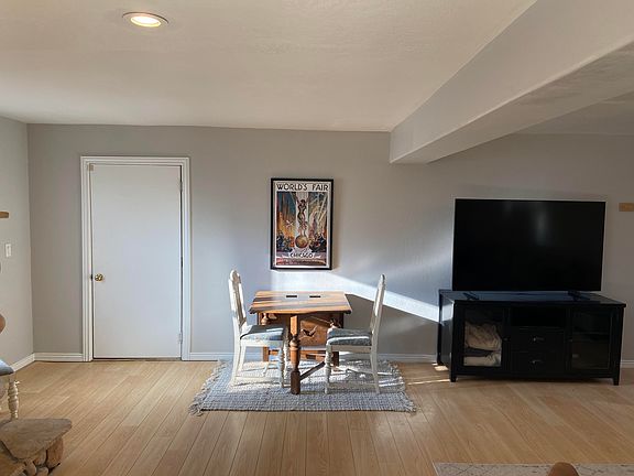 Dining table and door to garage (owner uses garage space).