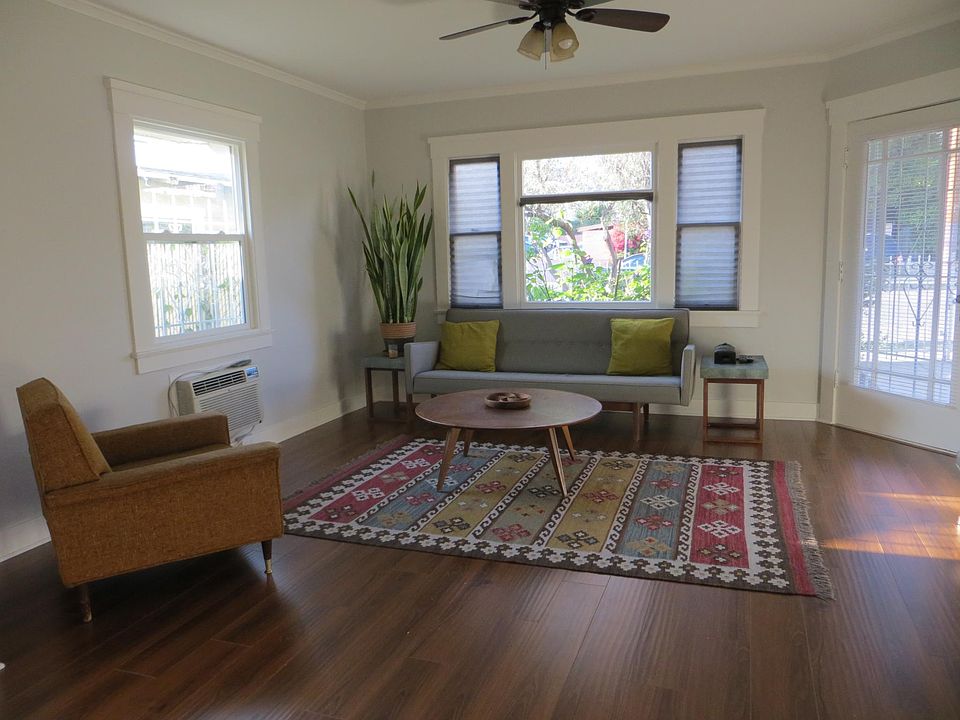 Bright and spacious living room. Photo of another unit, but almost identical.