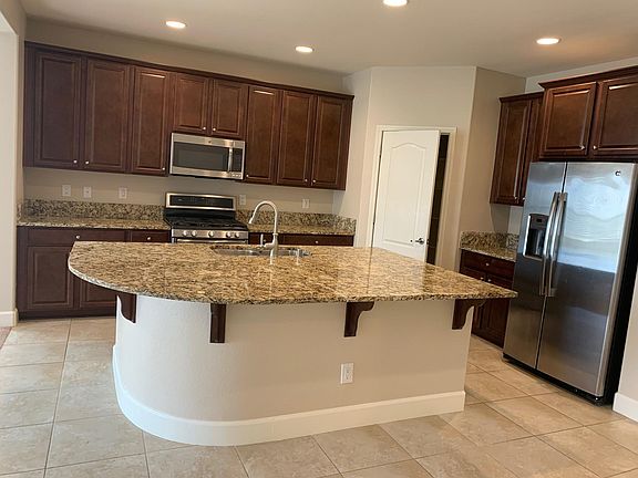 open kitchen with granite counter tops