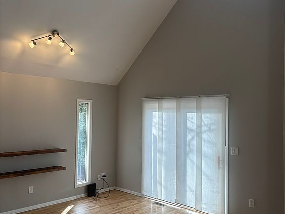 Living room w/vaulted ceiling.