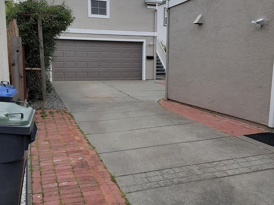 Driveway and detached 2 car garage. Apartment over garage is separate rental unit.
Driveway is 60' long.