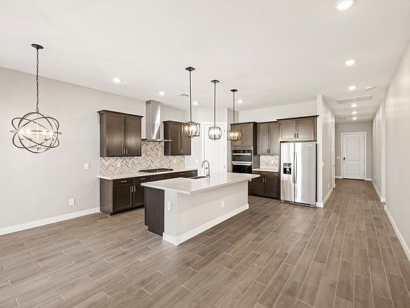 The Arlo floorplan image taken at Abel Ranch featuring a gourmet kitchen.