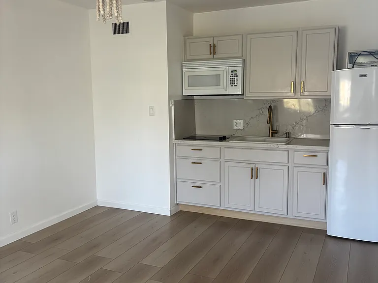 Kitchenette will be adding washer dryer combo to space next to kitchenette