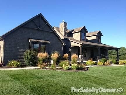 Main Front
						:
						Shake style siding, colonial red Pella windows w/ stained wood interior sashes