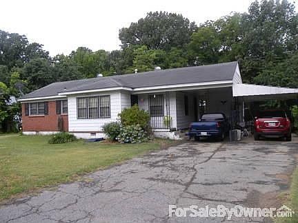 Front of house with double carport