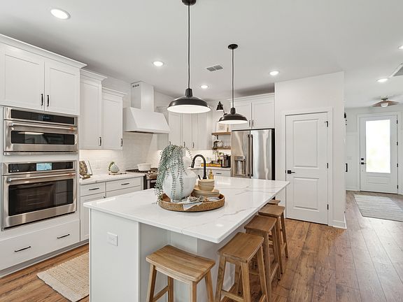Kitchen with pendant lights over island