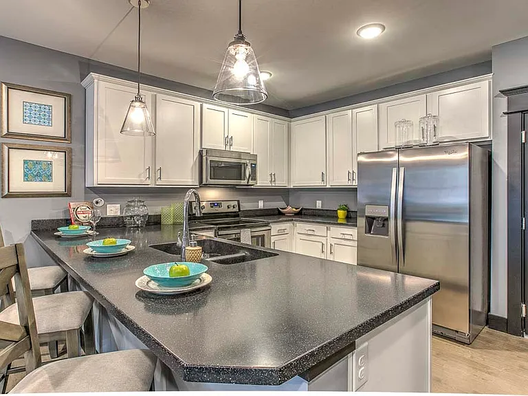 Modern kitchens with sleek appliances and granite countertops offer the ideal setup for cooking and entertaining.
