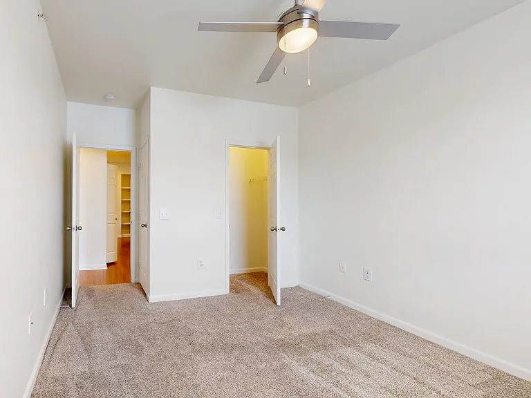 Spacious apartment Bedroom with Carpet Floor.