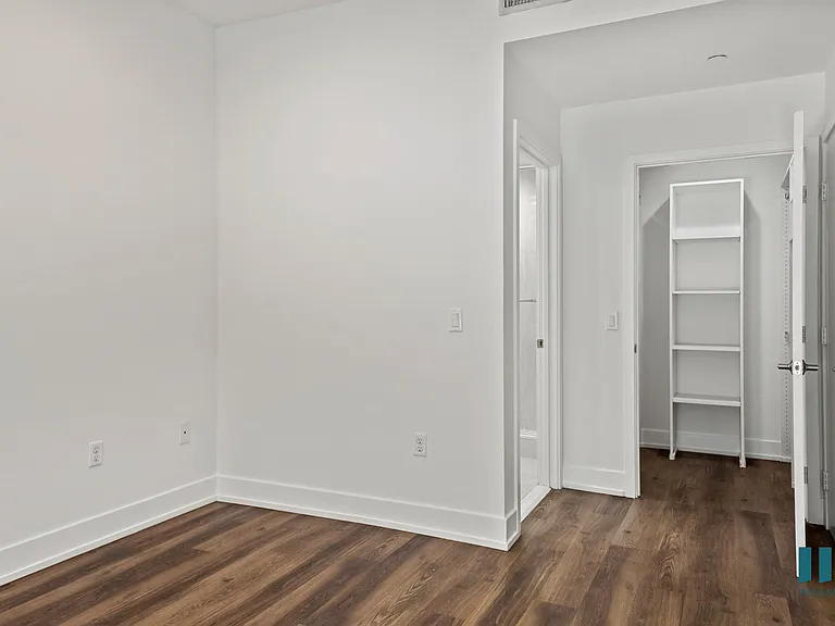 Bedroom with Closet with Built-In Shelving