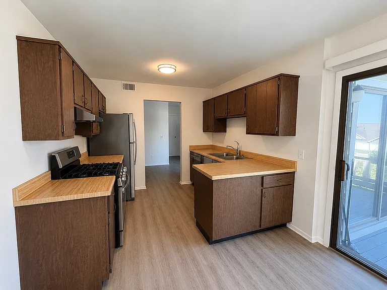 Kitchen with patio door leading to Private Balcony